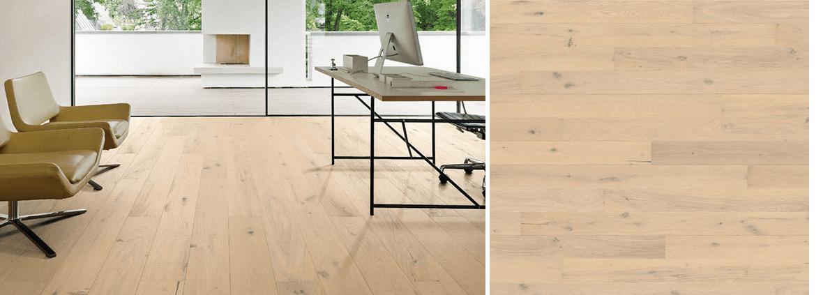 Light oak timber floor in a modern office with a glass wall and minimalist desk
