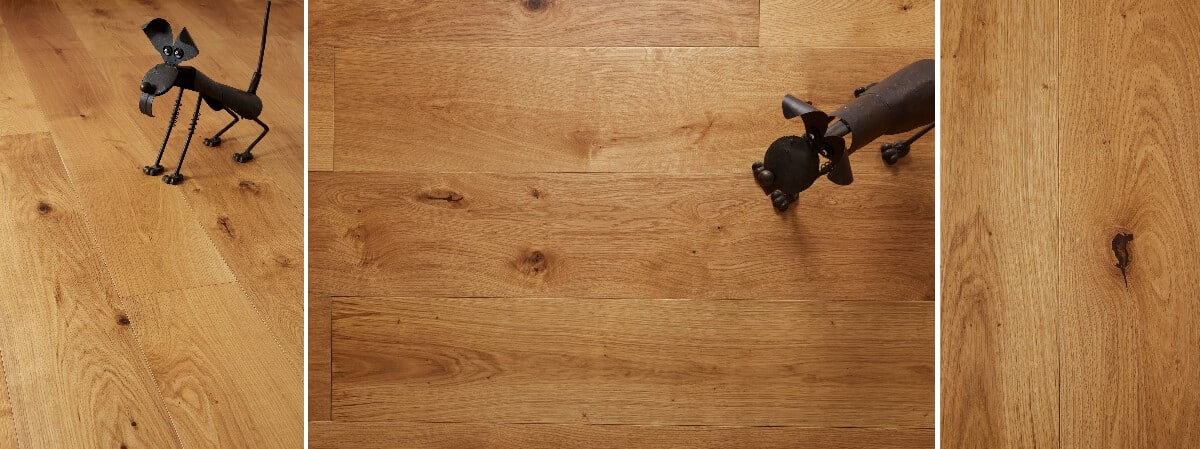A small metal dog figurine on a wooden hardwood floor, demonstrating details of wood grain and finish