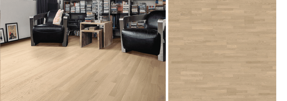 DIY enthusiast using hand held wood floor sander on hardwood flooring