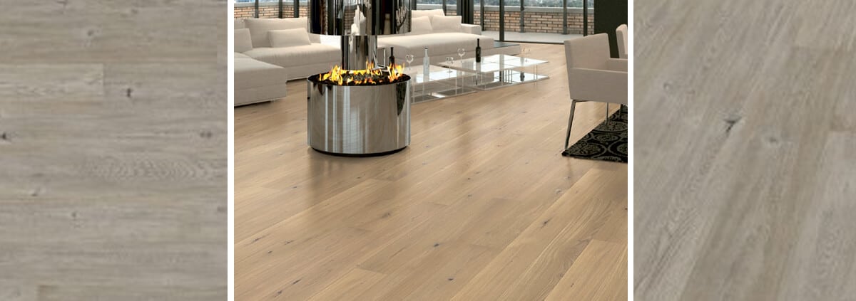 Homeowner sanding wood laminate floor with orbital sander